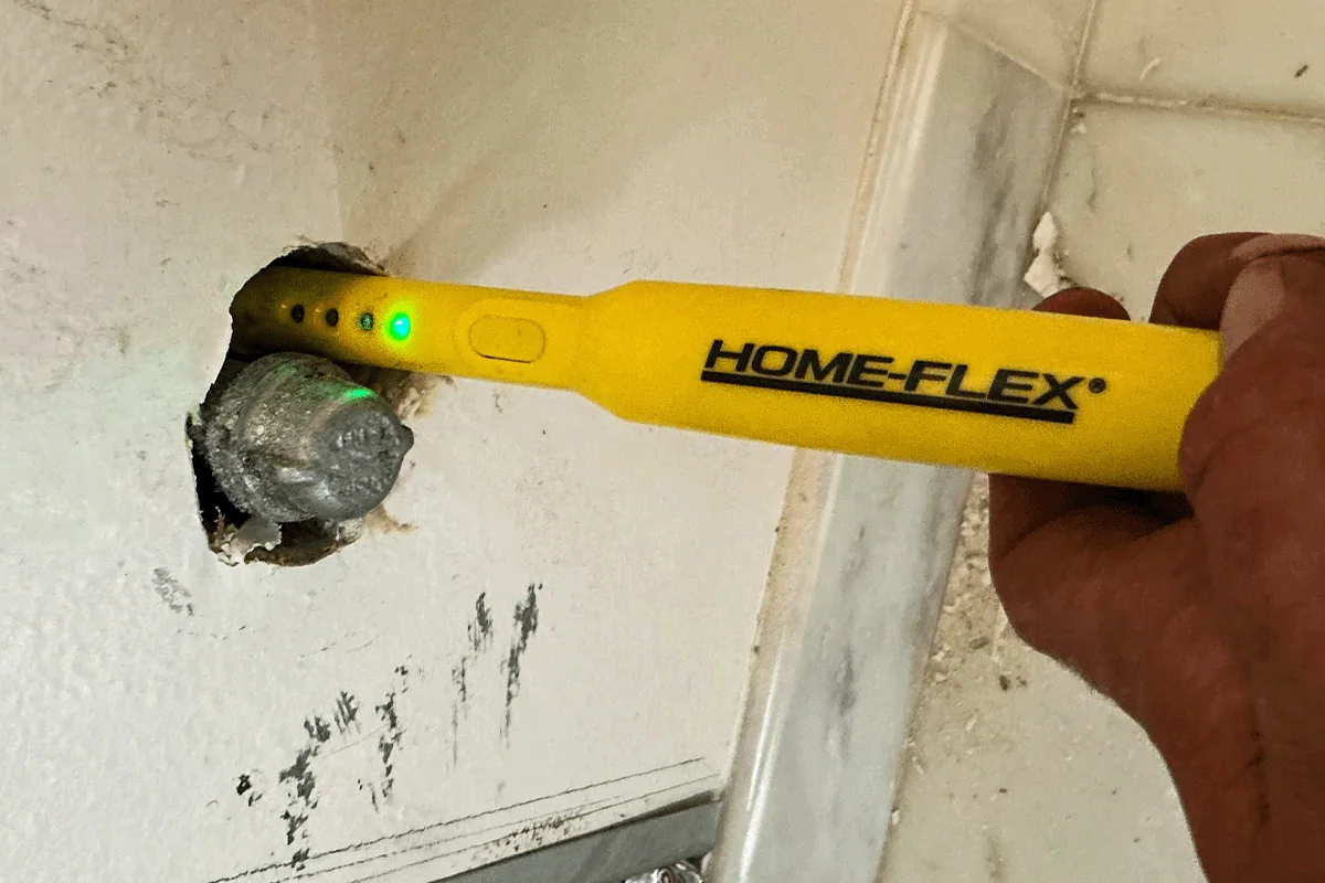 edp-gas-leak-detector-wall-2026 Electronic gas leak detector testing a pipe fitting — gas line repair and leak detection — EVERYDAYPLUMBER.com Tampa Bay