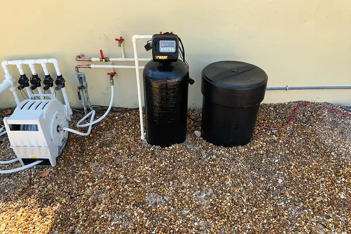 Whole-house water softener and filtration system installed outside a home — water softener and filtration — EVERYDAYPLUMBER.com Temple Terrace